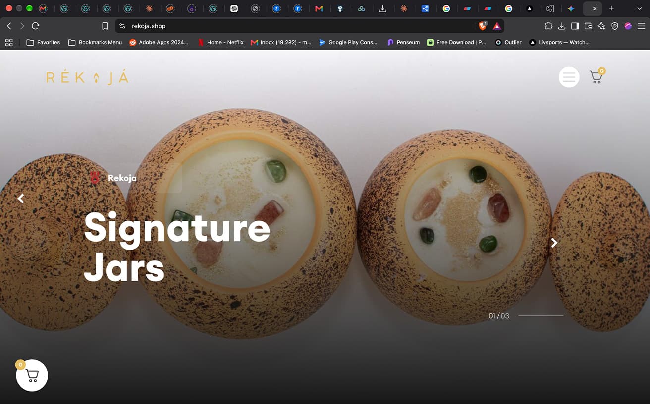 Rékọjá store homepage with the Signature Jars hero, showing speckled candle jars from above